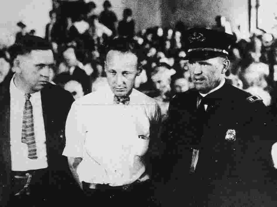 Scopes (center), a high school science teacher, was put on trial for teaching Darwin's theory of evolution, an act that was illegal. He was convicted and fined $100, but the verdict was overturned on appeal.