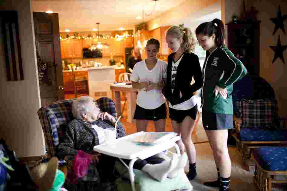 AnnaBelle talks to her granddaughter Carley (right) and Carley's friends after they returned from lacrosse practice. "I'm not rich money-wise, but with my family I'm a millionaire," AnnaBelle says.