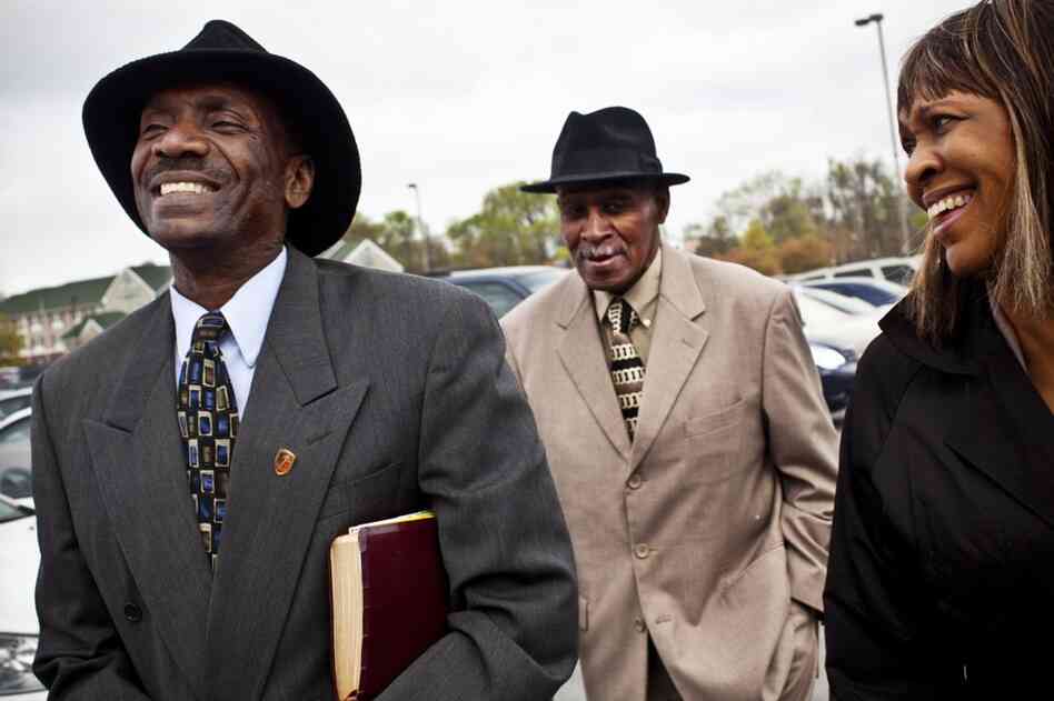 Natasha Shamone-Gilmore walks to church with her husband, Curtis (left), and her father, Franklin Brunson, 81, in Capitol Heights, Md. She has taken on the daily challenge of caring for her father, who is suffering from mild dementia. Her son Nicholas, 24, also lives in the family home.