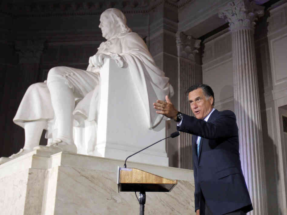 Courting Tea Party voters in Philadelphia on Monday night, Mitt Romney speaks next to a large statue of Benjamin Franklin at the Franklin Institute.