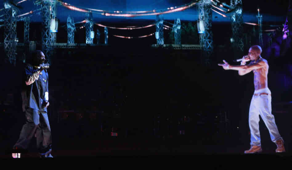 Near the end of his headlining set at the 2012 Coachella Valley Music & Arts festival, Snoop Dogg (left) performed next to a hologram of the deceased Tupac Shakur.
