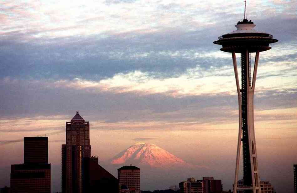 The Seattle Space Needle's 50th anniversary is Saturday. Though the top of the Needle has been off-white for years, it's being painted its original color, "galaxy gold," for the anniversary. The Seattle Space Needle's 50th anniversary is Saturday. Though the top of the Needle has been off-white for years, it's being painted its original color, "galaxy gold," for the anniversary.