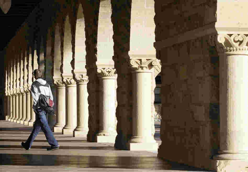 About 7 out of 10 students borrow money to pay for college. Here, a Stanford University student walks through the campus in Palo Alto, Calif. About 7 out of 10 students borrow money to pay for college. Here, a Stanford University student walks through the campus in Palo Alto, Calif.