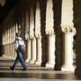 About 7 out of 10 students borrow money to pay for college. Here, a Stanford University student walks through the campus in Palo Alto, Calif.