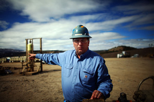 Mark Balderston, an engineer with Encana, a natural gas producer, points to a well pad completion site near Rifle, Colo. Mark Balderston, an engineer with Encana, a natural gas producer, points to a well pad completion site near Rifle, Colo.