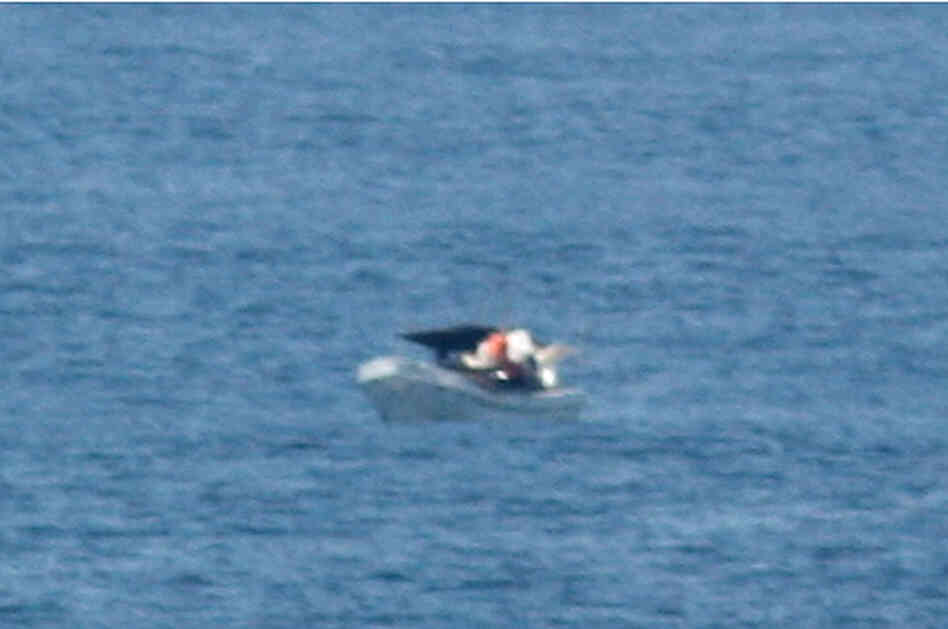 A zoomed-in view of the photo taken by Jeff Gilligan, of a boat drifting in the Pacific. When he saw the image, Adrian Vasquez — the boat's only survivor — said, "That's us."