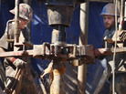 Oil field workers drill into the Gypsum Hills near Medicine Lodge, Kan., on Feb. 21. The Environmental Protection Agency announced new rules Wednesday to control the problem of air pollution coming from wells being drilled by the booming oil and natural gas drilling industry. Oil field workers drill into the Gypsum Hills near Medicine Lodge, Kan., on Feb. 21. The Environmental Protection Agency announced new rules Wednesday to control the problem of air pollution coming from wells being drilled by the booming oil and natural gas drilling industry.