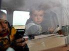 Syrian refugee children looked out of a bus last week after they arrived at a camp in Turkey. Syrian refugee children looked out of a bus last week after they arrived at a camp in Turkey.