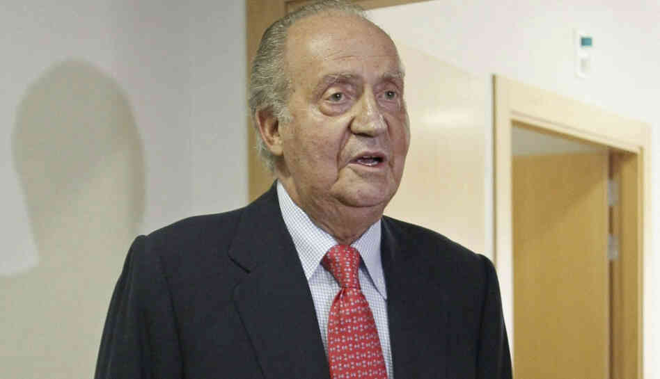Spain's King Juan Carlos prepares to leave a hospital in Madrid on Wednesday. Spain's King Juan Carlos says he is sorry for having gone on African elephant-hunting trip.