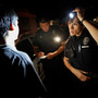 Tucson, Ariz., police officers work in the city's predominantly Hispanic South Side in May 2010. Since April 2010, when Arizona's controversial immigration bill passed into law, crime in the state has hit a 30-year low. Some attribute this to the law, but others are not so sure there's a connection.