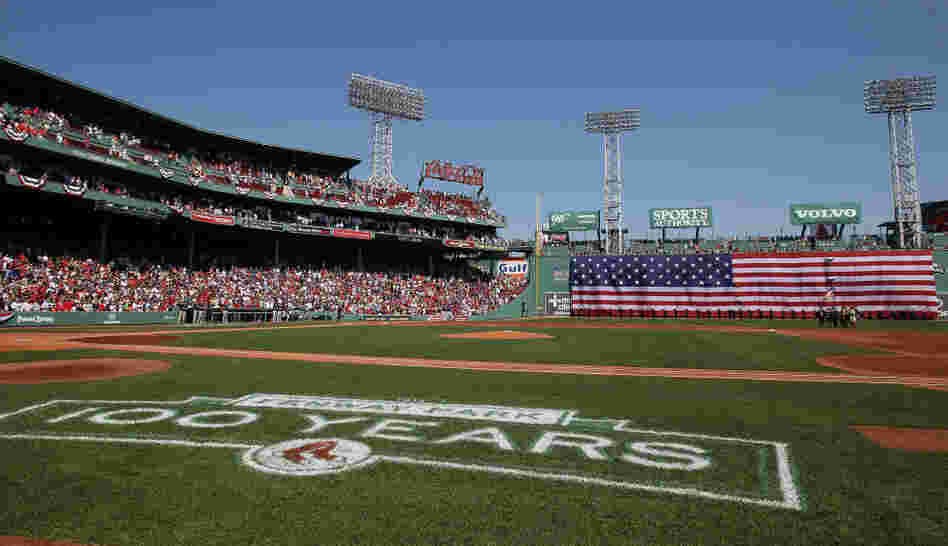 The flag covers the Green Monster as the national anthem is played before the game between the Boston Red Sox and the Tampa Bay Rays on April 16 at Fenway Park in Boston. The flag covers the Green Monster as the national anthem is played before the game between the Boston Red Sox and the Tampa Bay Rays on April 16 at Fenway Park in Boston.
