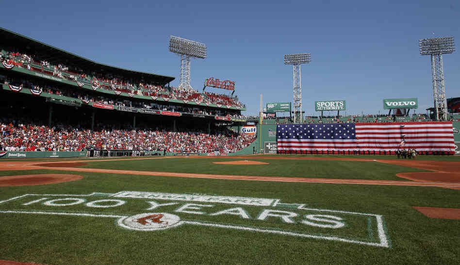 The flag covers the Green Monster as the national anthem is played before the game between the Boston Red Sox and the Tampa Bay Rays on April 16 at Fenway Park in Boston. The flag covers the Green Monster as the national anthem is played before the game between the Boston Red Sox and the Tampa Bay Rays on April 16 at Fenway Park in Boston.