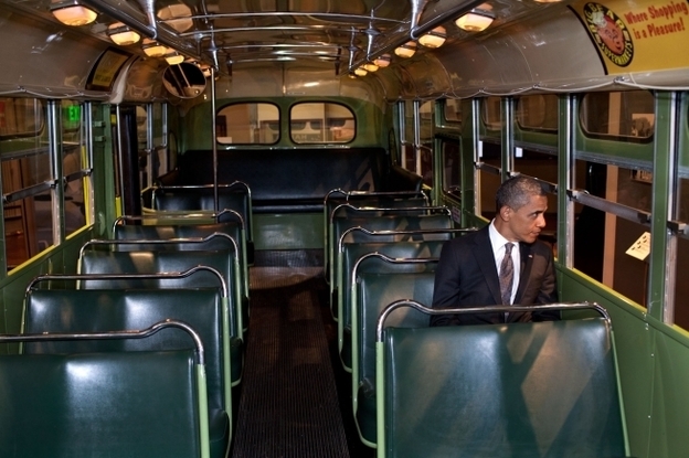 President Barack Obama sits on the famed Rosa Parks bus at the Henry Ford Museum following an event in Dearborn, Mich. on Wednesday.