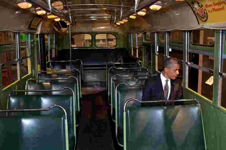 President Barack Obama sits on the famed Rosa Parks bus at the Henry Ford Museum following an event in Dearborn, Mich. on Wednesday.