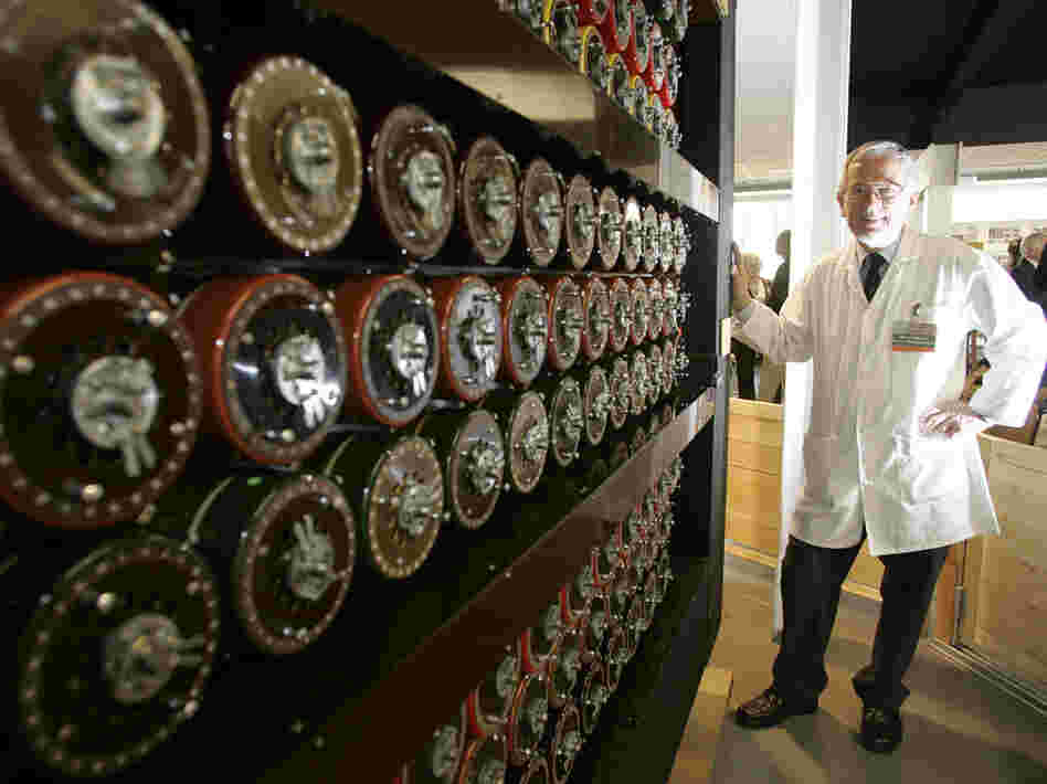 Mike Hillyard, a volunteer who helped build a replica of the Turing Bombe machine, stands beside the machine at Bletchley Park in Milton Keynes, England, in 2009.