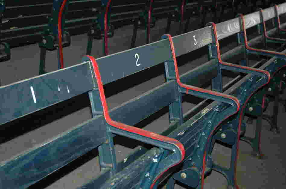 Fenways boasts "the oldest seats in baseball." Owners purposely decided not to sandblast the layers of paint, but rather to let these right field grandstand seats show their history and their age.