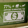 An advertisement for AmericansForGeorge.org is displayed in the Washington, D.C. metro.