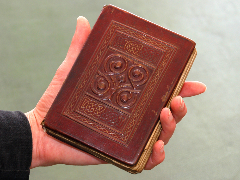 The Gospel, buried with St. Cuthbert in 698, was recovered from his grave in 1104. Its beautiful red leather binding is original.