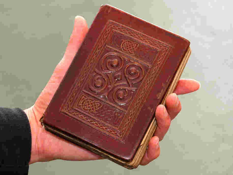 The Gospel, buried with St. Cuthbert in 698, was recovered from his grave in 1104. Its beautiful red leather binding is original.