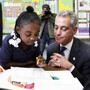 Chicago Mayor Rahm Emanuel sits with South Side first-graders in October. Emanuel's plan to lengthen the school day and the school year has met with resistance.