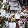 Mourners gather at the spot in front of the Greek parliament in Athens where 77-year-old retired pharmacist Dimitris Christoulas shot and killed himself on April 4. Christoulas left a note saying he did not want to end up scrounging for food in garbage bins.