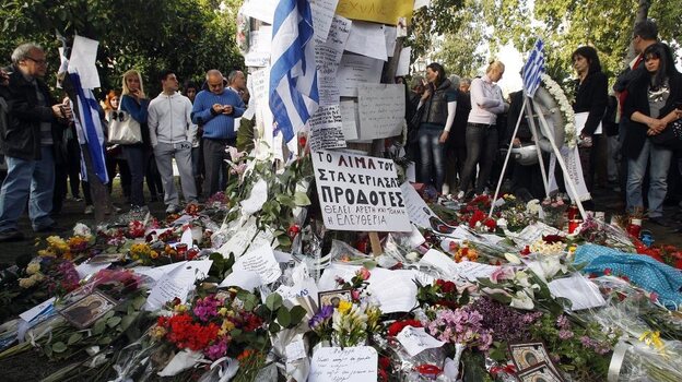 Mourners gather at the spot in front of the Greek parliament in Athens where 77-year-old retired pharmacist Dimitris Christoulas shot and killed himself on April 4. Christoulas left a note saying he did not want to end up scrounging for food in garbage bins.