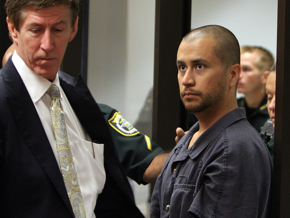 Defense attorney Mark O'Mara (left) stands with his client, George Zimmerman, at a hearing related to second-degree murder charges in the killing of Trayvon Martin in Sanford, Fla.