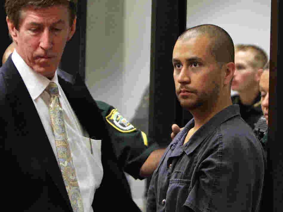 Defense attorney Mark O'Mara (left) stands with his client, George Zimmerman, at a hearing related to second-degree murder charges in the killing of Trayvon Martin in Sanford, Fla.