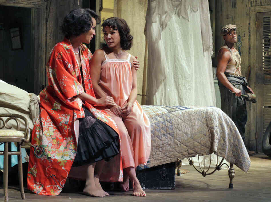 Sisters Blanche and Stella talk as Stanley looks on, contributing to a growing divide between husband and wife.
