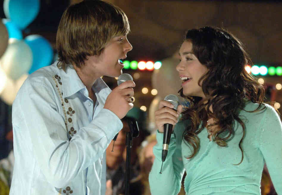 Actors Zac Efron, as basketball star Troy, left, and Vanessa Anne Hudgens, as the shy academic Gabriella, in High School Musical, seen in this undated photo released by the Disney Channel.