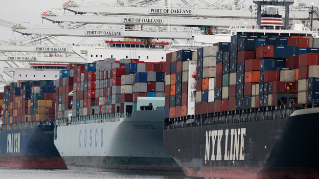 Container ships are positioned under cranes at the Port of Oakland in California. U.S. exports are up more than 30 percent from just two years ago, when President Obama set a goal of doubling U.S. exports in five years.