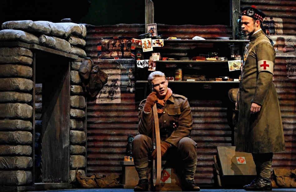 Father Palmer (Troy Cook, right) comforts Scottish soldier Jonathan Dale (John Robert Lindsey), who laments the loss of his brother in the battle.