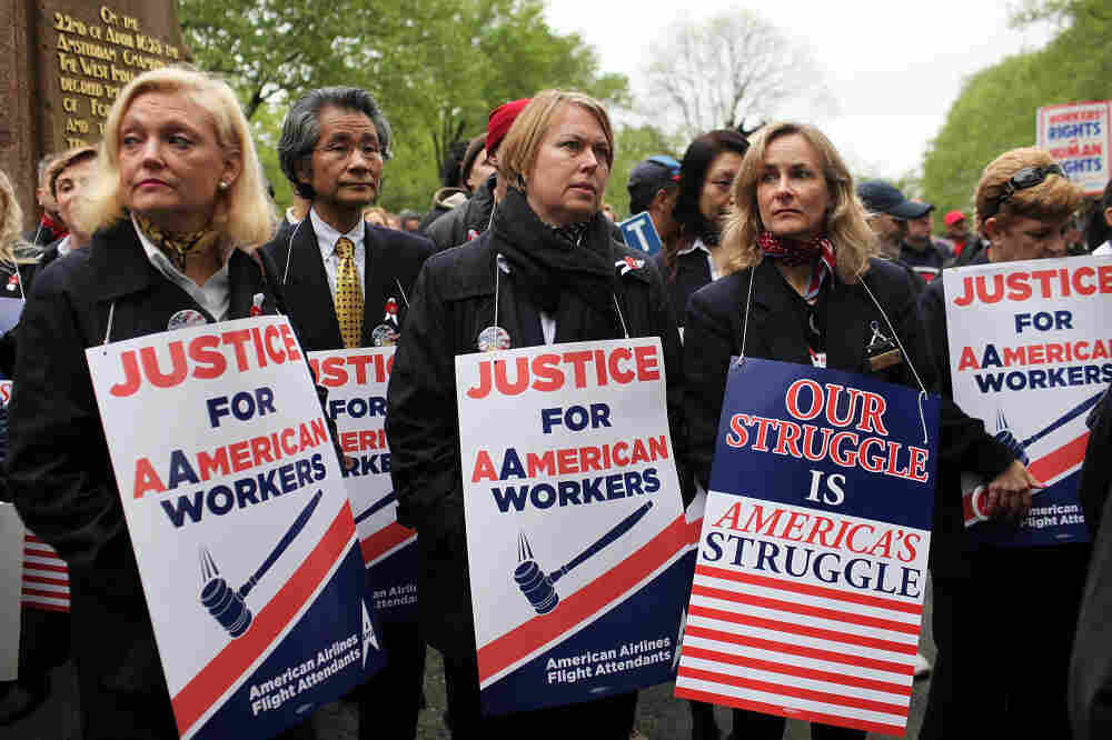 American Airlines and American Eagle employees protest Monday in New York City against American's plans to cut jobs and labor costs while under bankruptcy court protection. American is seeking permission to break up union contracts and cut expenses, but the unions oppose those plans and support a potential takeover bid by US Airways. American Airlines and American Eagle employees protest Monday in New York City against American's plans to cut jobs and labor costs while under bankruptcy court protection. American is seeking permission to break up union contracts and cut expenses, but the unions oppose those plans and support a potential takeover bid by US Airways.