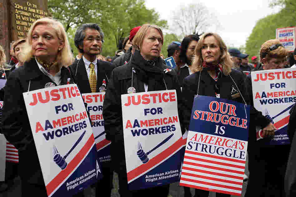 American Airlines and American Eagle employees protest Monday in New York City against American's plans to cut jobs and labor costs while under bankruptcy court protection. American is seeking permission to break up union contracts and cut expenses, but the unions oppose those plans and support a potential takeover bid by US Airways. American Airlines and American Eagle employees protest Monday in New York City against American's plans to cut jobs and labor costs while under bankruptcy court protection. American is seeking permission to break up union contracts and cut expenses, but the unions oppose those plans and support a potential takeover bid by US Airways.
