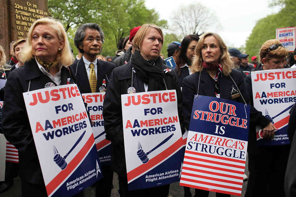 American Airlines and American Eagle employees protest Monday in New York City against American's plans to cut jobs and labor costs while under bankruptcy court protection. American is seeking permission to break up union contracts and cut expenses, but the unions oppose those plans and support a potential takeover bid by US Airways. American Airlines and American Eagle employees protest Monday in New York City against American's plans to cut jobs and labor costs while under bankruptcy court protection. American is seeking permission to break up union contracts and cut expenses, but the unions oppose those plans and support a potential takeover bid by US Airways.