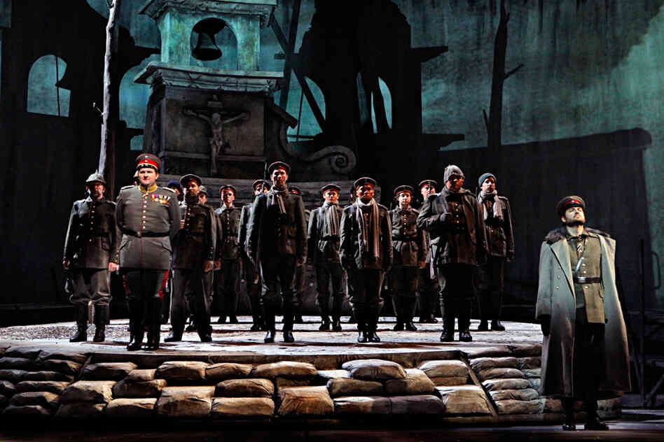 Near the end of the opera, the German soldiers — led by A. J. Glueckert as Kronprinz, son of Kaiser Wilhelm II (far right), and Craig Irvin as Lieutenant Horstmayer (left) — prepare to be shipped off to the Russian front.