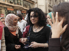 Mona Eltahawy (center), a prominent Egyptian-born, U.S.-based columnist, and Egyptian activist Samira Ibrahim (left) march in downtown Cairo to mark International Women's Day in March. Mona Eltahawy (center), a prominent Egyptian-born, U.S.-based columnist, and Egyptian activist Samira Ibrahim (left) march in downtown Cairo to mark International Women's Day in March.