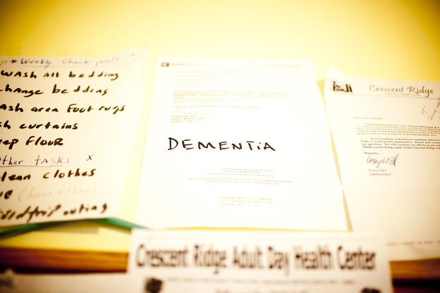 Natasha Shamone-Gilmore keeps a letter from her father's doctor diagnosing him with dementia on a wall in her kitchen. She uses it at times to remind Franklin Brunson of his condition.