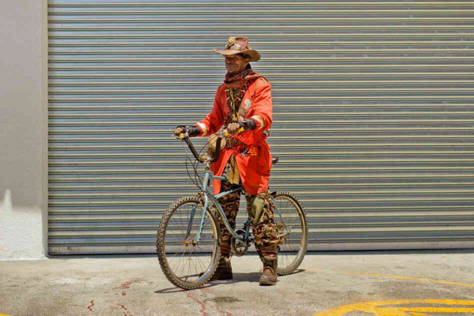 Asher Tafara: "I travel with the bike to get some herbs and medicines on the mountains. I do healing of the people and selling medicines for a living."