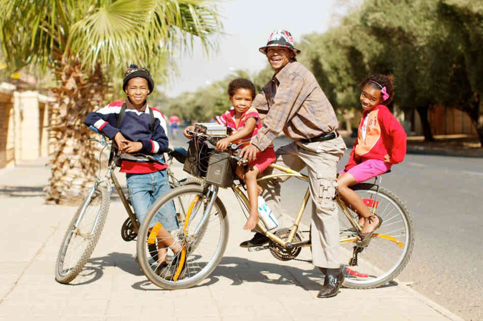 Johannes van Wyk with Chris, Danisha and Sarie: "At our home we fix bicycles, and our dad always used to ride and all those type of things, so we also made it a part of us. It is very important to us."