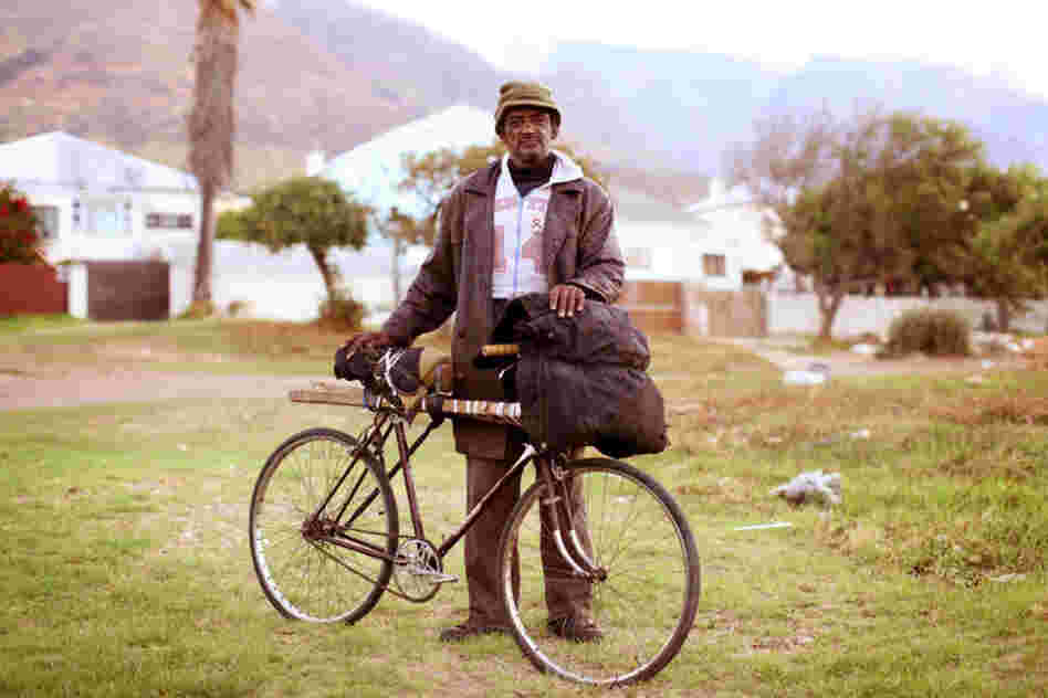 Micky Abrahams: "I ride around on this bike. ... I bought it so I can just go on with life. I'm short of breath — with the bike I can go further. I ride my bike every day. ... I live out on the road. On heaven's road. Out on the bushy ground, along the marsh where the rivers are. And places like that. I sleep out there at night."