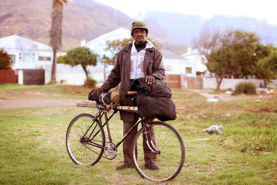 Micky Abrahams: "I ride around on this bike. ... I bought it so I can just go on with life. I'm short of breath — with the bike I can go further. I ride my bike every day. ... I live out on the road. On heaven's road. Out on the bushy ground, along the marsh where the rivers are. And places like that. I sleep out there at night."