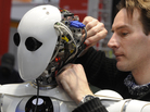 A technician works on the DFKI robot AILA at a German trade fair in 2010. A technician works on the DFKI robot AILA at a German trade fair in 2010.
