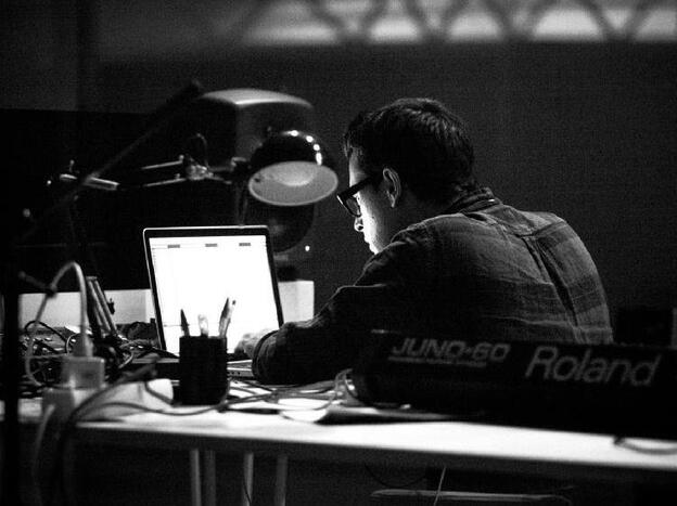 Don't let the laptop pose fool you. Brian Allen Simon (aka Anenon) uses real keyboards, synths and a saxophone to make his electronic music.