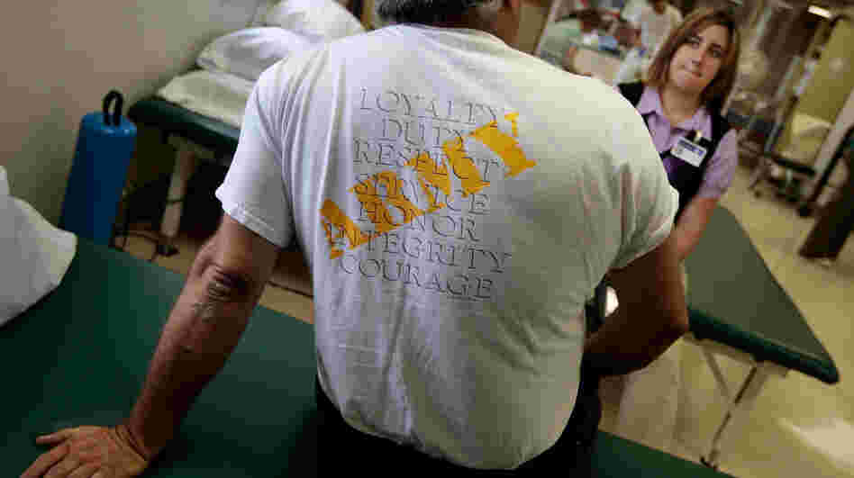 A veteran of the Iraq War with post-traumatic stress disorder talks to physical therapist Nicole Bormann before a session in the VA Medical Center in St. Louis. A veteran of the Iraq War with post-traumatic stress disorder talks to physical therapist Nicole Bormann before a session in the VA Medical Center in St. Louis.