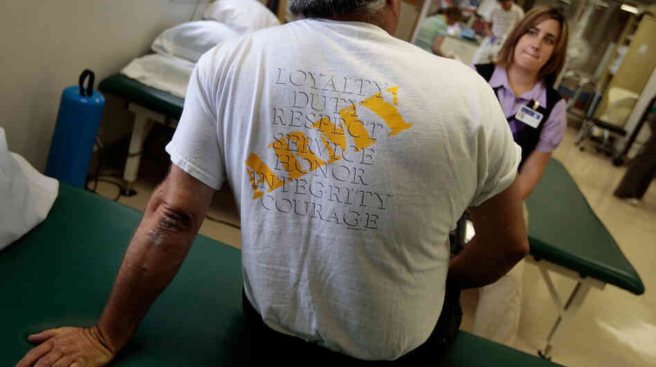 A veteran of the Iraq War with post-traumatic stress disorder talks to physical therapist Nicole Bormann before a session in the VA Medical Center in St. Louis. A veteran of the Iraq War with post-traumatic stress disorder talks to physical therapist Nicole Bormann before a session in the VA Medical Center in St. Louis.