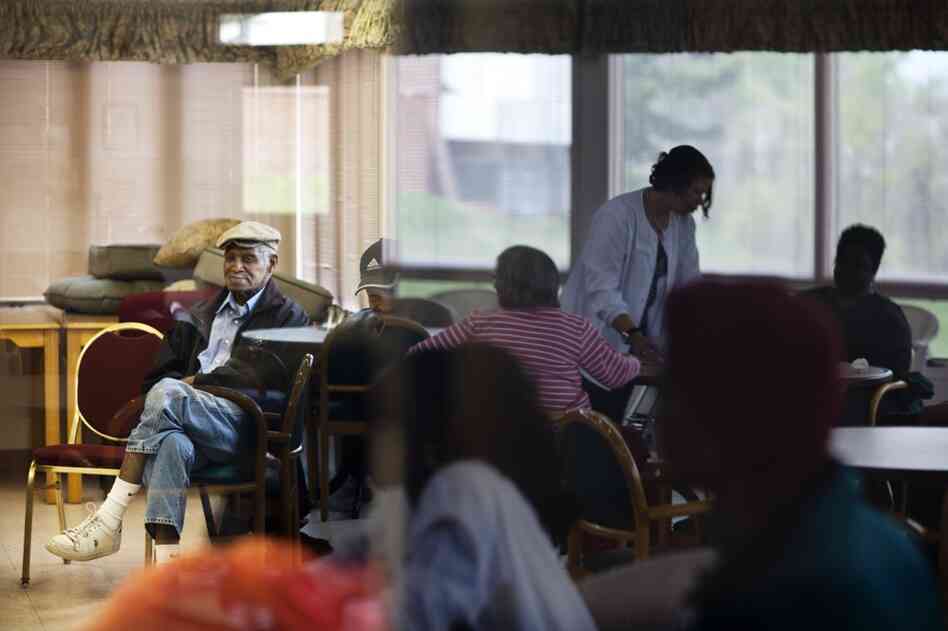 Franklin sits patiently waiting for his tai chi class to begin at Crescent Ridge. Several dozen residents who live with dementia, Alzheimer's or other brain injuries spend their day at the center.