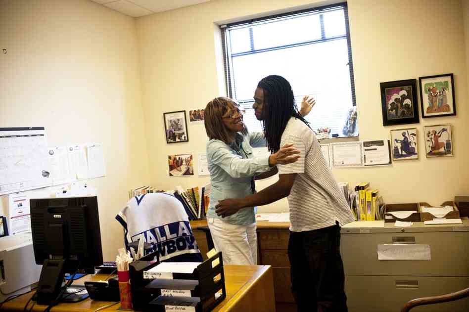 Natasha hugs Nicholas at the office where she works as an industrial trainer. Nicholas stopped by to get some money for gas and to fix his car.