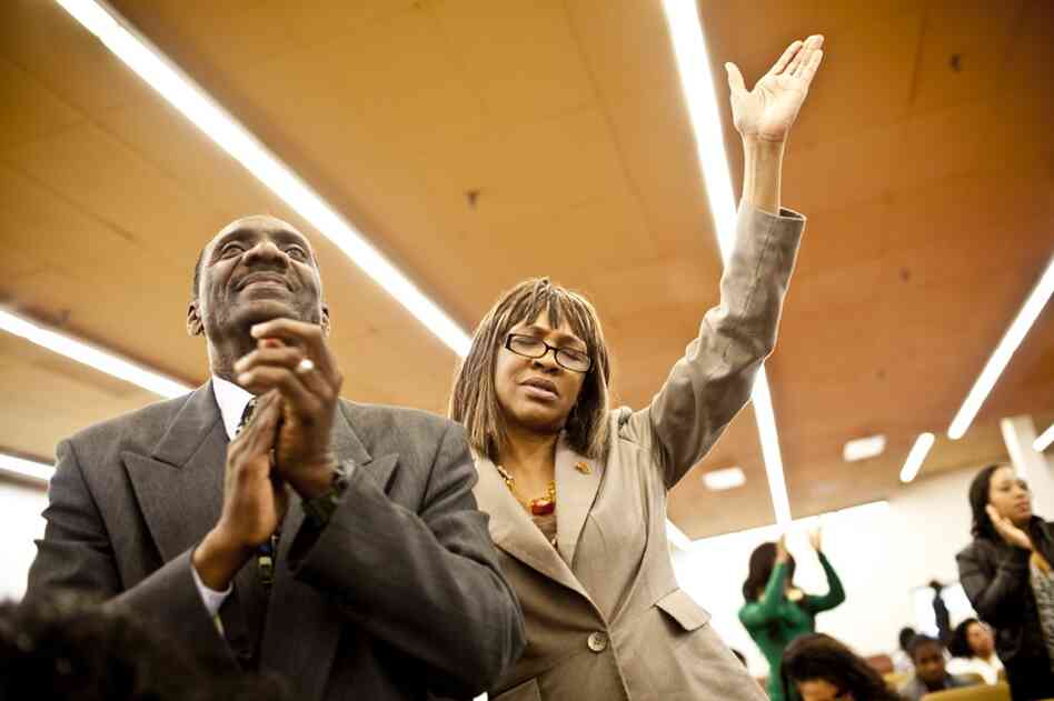 Natasha and Curtis pray during Sunday worship at The Sanctuary Baptist church in Capitol Heights, Md. "She is always trying to take care of someone or something — a dog, a cat, a bird," Franklin says of Natasha. "She has been that way since she was knee-high."