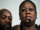 Sybrina Fulton, mother of Trayvon Martin, speaks as Trayvon's father Traci Martin listens.